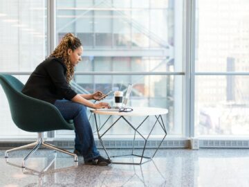 woman sitting on blue and gray chair