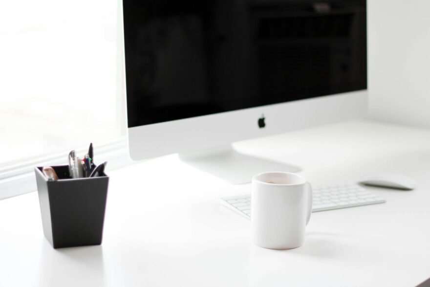 white imac and apple magic keyboard