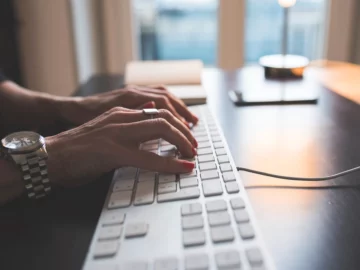 Woman Typing Computer Keyboard