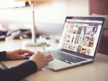 person using laptop computer during daytime